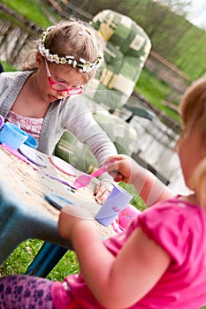 Little girls playing outdoors