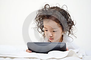 Little girls playing on a tablet computing device