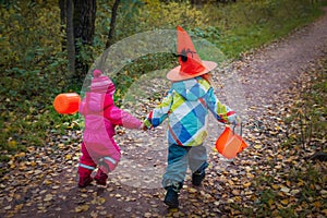 Little girls run to trick or treat, halloween celebration