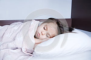 Little girls sleeping lying on bed. sleep schedule in domestic lifestyle. cute child