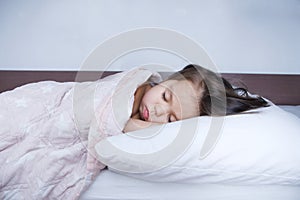 Little girls sleeping lying on bed. sleep schedule in domestic lifestyle. cute child