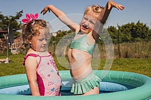 Little girls in swimming pool