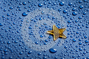 A little golden star and blue water dorops