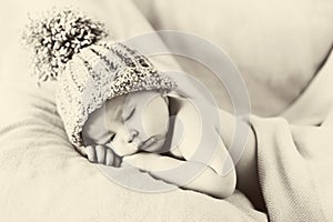 Little gorgeous baby boy with a big hat