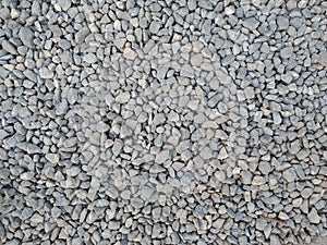 Little grey stone texture. Macadam, breakstone. photo
