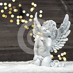 Little guardian angel with shiny lights. christmas decoration