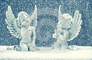 Little guardian angels in snow. christmas decoration