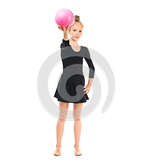 Little gymnast doing exercise with ball