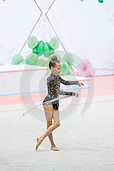 Little gymnast training on the carpet and ready for competitions