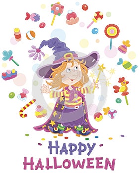 Little Halloween witch juggling with sweets