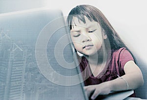 Little hancker is coding on laptop computer photo