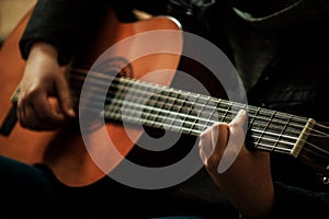 Little hand on  guitar close-up