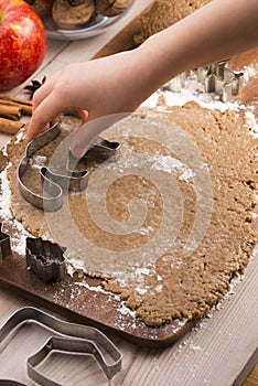 Little hands making the gingerbread cookies