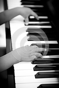 Little hands playing on the piano