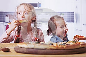 Little happy child girl holding pizza slices as symbol of best food. Food, joy, childhood, nutrition concept