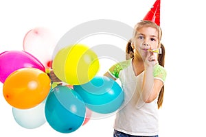 Little happy girl celebrating birthday with multicolor ballons