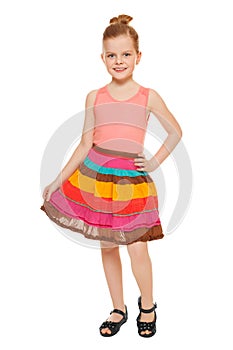 Little happy girl full lenght in colorful skirt, isolated on white background