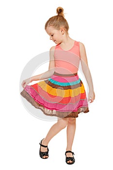 Little happy girl full lenght in colorful skirt, isolated on white background photo