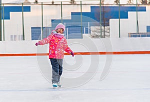 Little happy girl skating