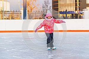 Little happy girl skating