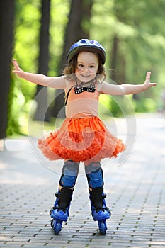 Little happy girl in skirt and helmet