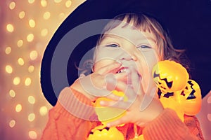 Little happy kid with halloween decorations, beautiful lightings.