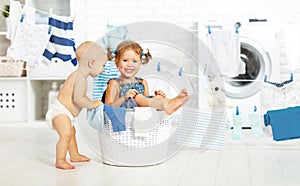 Little helpers funny kids happy in laundry to wash clothes, pla