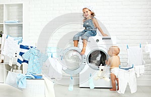 Little helpers funny kids happy sister and brother in laundry to