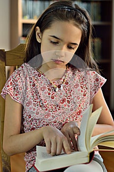 Little Hispanic Girl Reading