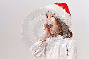 Little hispanic girl wearing christmas hat clueless and confused with open arms, no idea and doubtful face