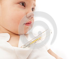 Little ill kid with mercurial thermometer