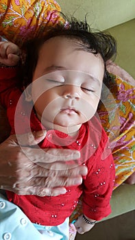 Little infant girl sleeping peaceful expression