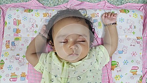 Little infant girl sleeping peaceful expression