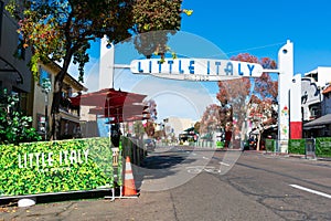 Little Italy sign India Street welcomes visitors to historic tourist destination under blue sky. - San Diego, California, USA -