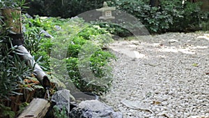 Little japanese fountain in garden