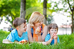 Little kid bite fresh apple