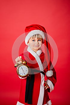 Little kid boy dressed as Santa Claus. Christmas shopping. Christmas present. Childhood. New Year party. Santa Claus baby