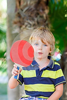 Little kid boy with table tennis racquet