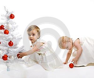 Little kid with a christmas tree photo
