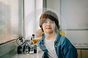 little kid with diy robot at stem