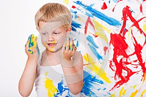 Little kid draws bright colors. School. Preschool. Education. Creativity. Studio portrait over white background