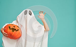 Little kid in ghost costume