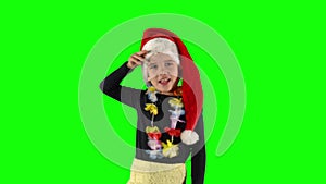 Little kid girl 5 years old with Santa hat looking far away distance