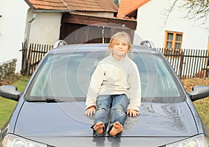 Little kid - girl on hood of car