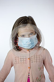 Little kid girl with the mask on face during epidemy
