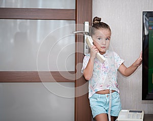 Little kid girl talking on phone