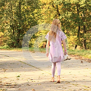 Little kid - girl walking barefoot