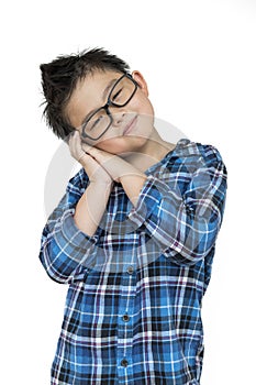 Little kid in glasses feels sleepy on isolated white background