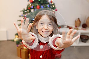 Little kid with hands full of christmas glitter