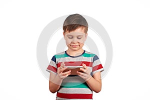 Little kid playing games on smartphone isolated over white background